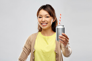 Image showing happy asian woman with can drink