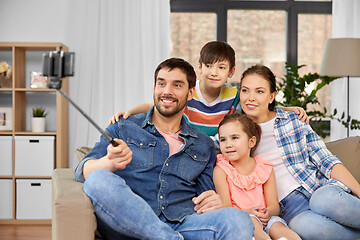 Image showing happy family taking selfie at home