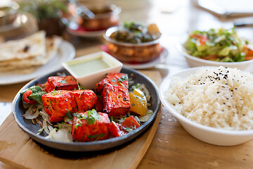 Image showing close up of paneer tikka dish with sauce on table