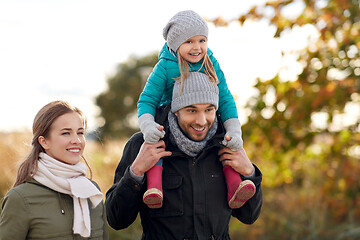 Image showing happy family walking in autumn