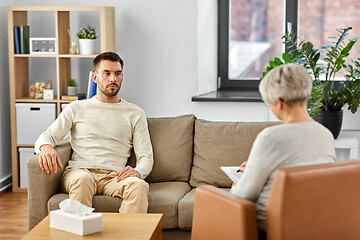 Image showing senior woman psychologist and sad man patient