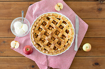 Image showing apple pie with ice cream on wooden table