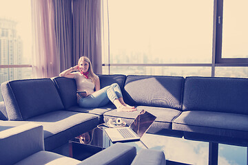 Image showing couple relaxing at  home using tablet computer