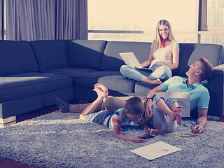 Image showing young couple spending time with kids at home