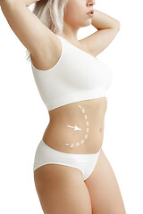 Image showing Female body with the drawing arrows. Fat lose, liposuction and cellulite removal concept