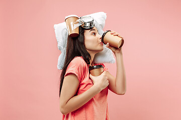 Image showing Tired woman at home having too much work. Bored businesslady with pillow and coffee