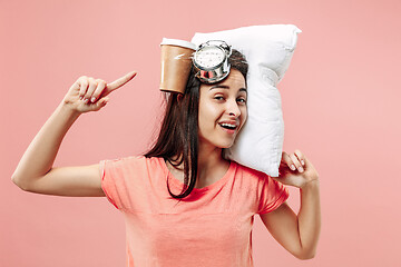 Image showing Tired woman at home having too much work. Bored businesslady with pillow and coffee