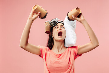 Image showing Tired woman at home having too much work. Bored businesslady with pillow and coffee