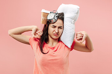 Image showing Tired woman at home having too much work. Bored businesslady with pillow and coffee