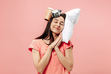 Image showing Tired woman sleeping at home having too much work. Bored businesslady with pillow and coffee