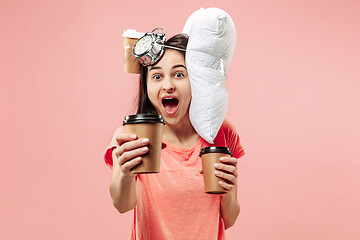 Image showing Tired woman at home having too much work. Bored businesslady with pillow and coffee