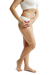 Image showing Female body with the drawing arrows. Fat lose, liposuction and cellulite removal concept