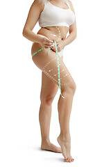 Image showing Female body with the drawing arrows. Fat lose, liposuction and cellulite removal concept