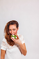 Image showing Woman eating bread with cream cheese