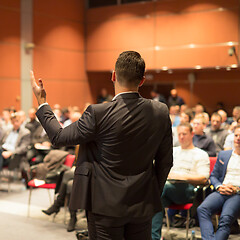 Image showing Public speaker giving talk at business event.