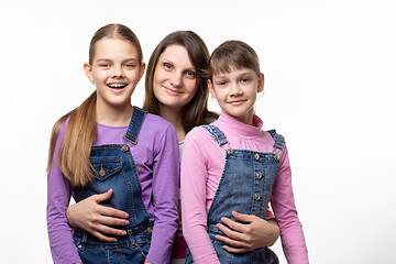 Image showing Portrait of a family, mom with two daughters, on a white background