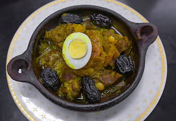 Image showing Tajine with meat and prunes in pottery