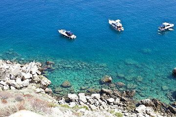 Image showing View of the Tremiti Islands. Boats near a rock stone coast.