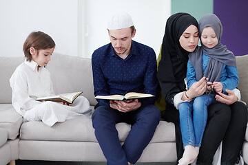 Image showing muslim family reading Quran and praying at home