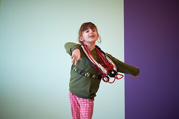 Image showing girl having fun and dancing wearing mothers jewelry