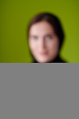 Image showing Woman in Abaya Holding a Date Fruit and glass of water