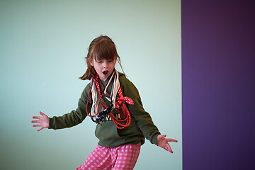 Image showing girl having fun and dancing wearing mothers jewelry