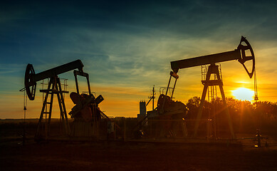 Image showing Two working oil pumps silhouette