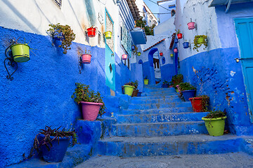 Image showing Blue street with color pots in Chefchaouen