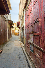 Image showing Old street with red door in Fes medina