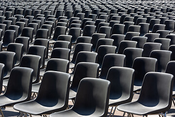 Image showing Rows of empty black plastic seats