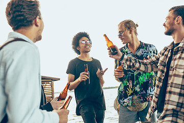 Image showing Group of friends celebrating, resting, having fun and party in summer day