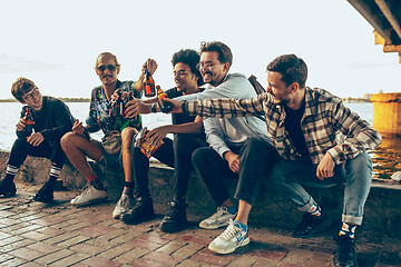 Image showing Group of friends celebrating, resting, having fun and party in summer day