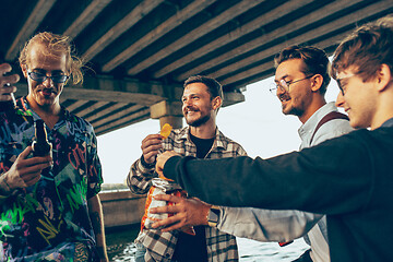 Image showing Group of friends celebrating, resting, having fun and party in summer day