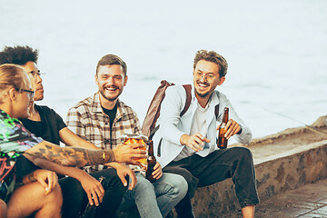 Image showing Group of friends celebrating, resting, having fun and party in summer day