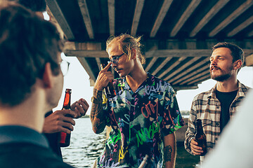 Image showing Group of friends celebrating, resting, having fun and party in summer day