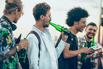 Image showing Group of friends celebrating, resting, having fun and party in summer day