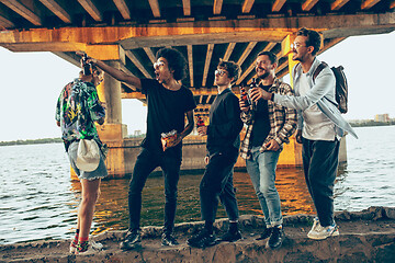 Image showing Group of friends celebrating, resting, having fun and party in summer day