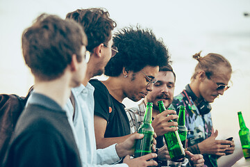 Image showing Group of friends celebrating, resting, having fun and party in summer day