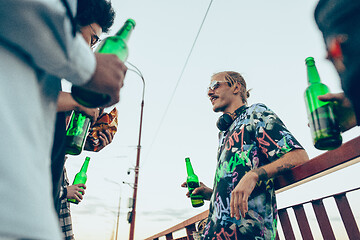 Image showing Group of friends celebrating, resting, having fun and party in summer day