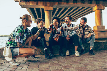 Image showing Group of friends celebrating, resting, having fun and party in summer day