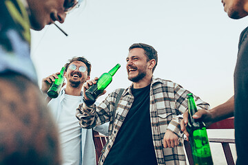 Image showing Group of friends celebrating, resting, having fun and party in summer day