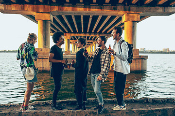 Image showing Group of friends celebrating, resting, having fun and party in summer day