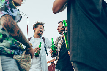 Image showing Group of friends celebrating, resting, having fun and party in summer day