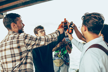 Image showing Group of friends celebrating, resting, having fun and party in summer day