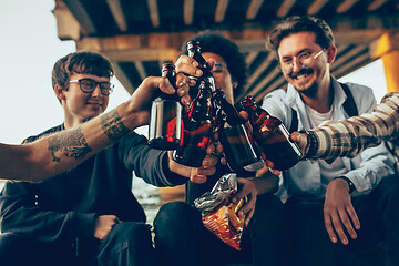 Image showing Group of friends celebrating, resting, having fun and party in summer day