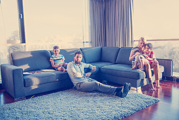 Image showing Happy Young Family Playing Together on sofa