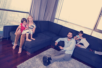 Image showing Happy Young Family Playing Together on sofa