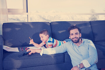 Image showing Happy Young Family Playing Together on sofa