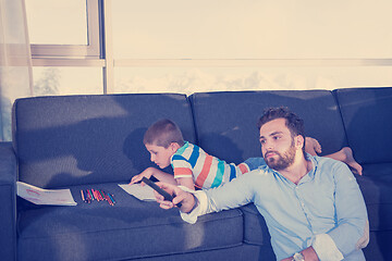 Image showing Happy Young Family Playing Together on sofa