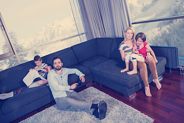 Image showing Happy Young Family Playing Together on sofa